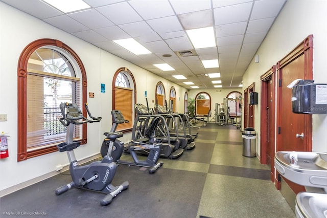203 La Mirage St, Davenport, FL 33897 - gym featuring a drop ceiling and baseboards