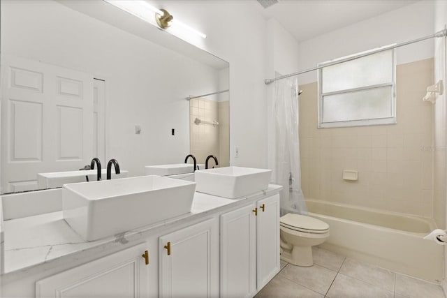 bathroom with tile patterned flooring, shower / tub combo with curtain, toilet, and double vanity