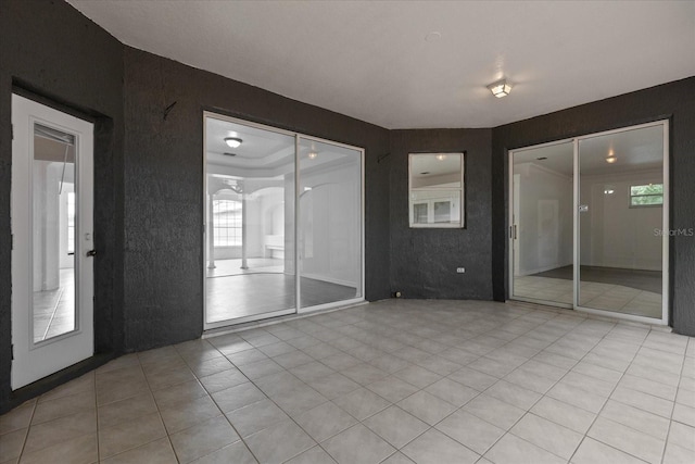 unfurnished room with light tile patterned floors