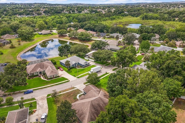 aerial perspective of suburban area with a nearby body of water