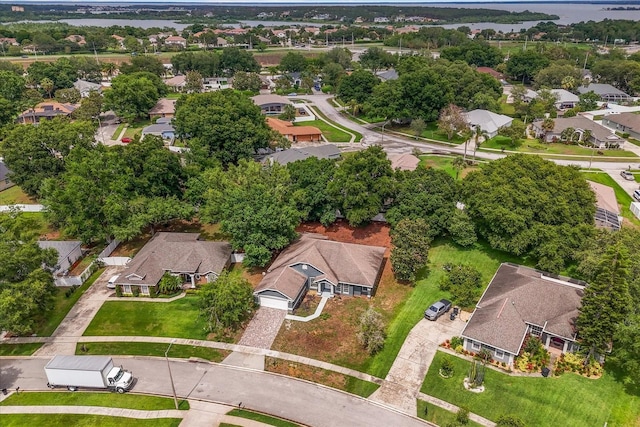 aerial overview of property's location with nearby suburban area and a nearby body of water