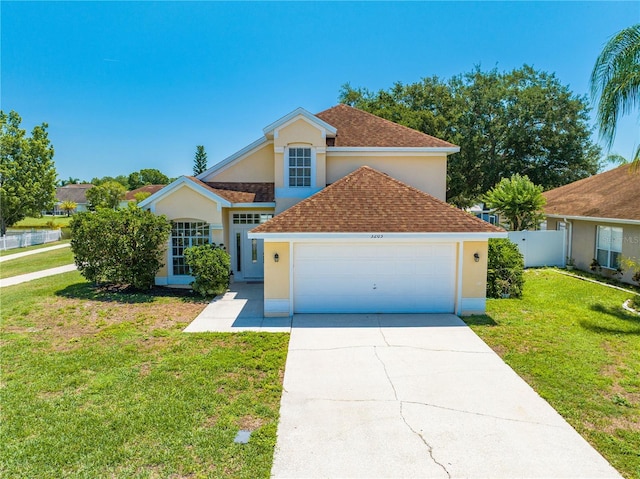 3203 Herons Point Cir, Kissimmee, FL 34741 - traditional-style house with stucco siding, a garage, roof with shingles, and driveway