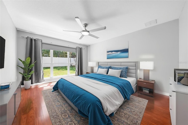 3203 Herons Point Cir, Kissimmee, FL 34741 - bedroom featuring wood finished floors, ceiling fan, and baseboards