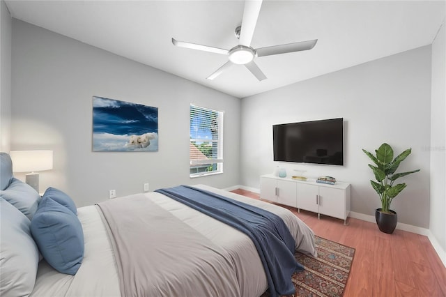 3203 Herons Point Cir, Kissimmee, FL 34741 - bedroom with wood finished floors, baseboards, and ceiling fan
