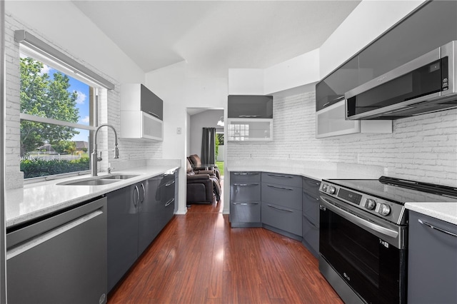 3203 Herons Point Cir, Kissimmee, FL 34741 - kitchen with stainless steel appliances, a sink, gray cabinets, tasteful backsplash, and modern cabinets