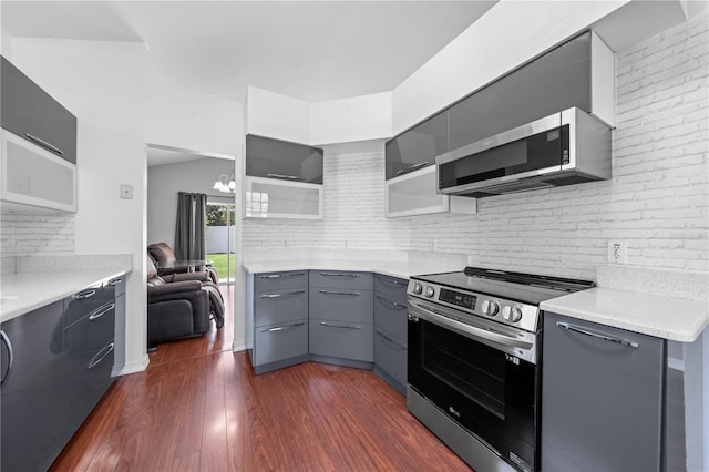 3203 Herons Point Cir, Kissimmee, FL 34741 - kitchen with stainless steel appliances, gray cabinets, and modern cabinets