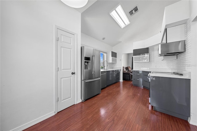 3203 Herons Point Cir, Kissimmee, FL 34741 - kitchen with stainless steel appliances, light countertops, decorative backsplash, gray cabinetry, and a sink