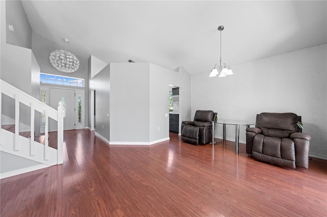 3203 Herons Point Cir, Kissimmee, FL 34741 - foyer entrance with a chandelier, high vaulted ceiling, stairway, wood finished floors, and baseboards