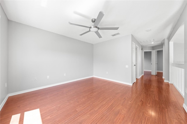 3203 Herons Point Cir, Kissimmee, FL 34741 - unfurnished room featuring a ceiling fan, wood finished floors, and baseboards