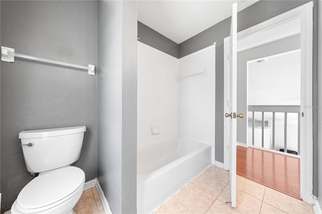 3203 Herons Point Cir, Kissimmee, FL 34741 - bathroom with toilet, tile patterned floors, and baseboards