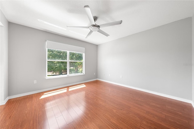 3203 Herons Point Cir, Kissimmee, FL 34741 - spare room featuring ceiling fan, wood finished floors, and baseboards