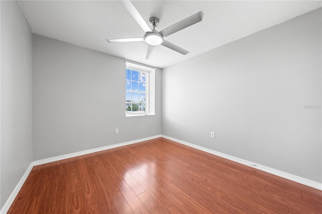 3203 Herons Point Cir, Kissimmee, FL 34741 - empty room with ceiling fan, baseboards, and wood finished floors
