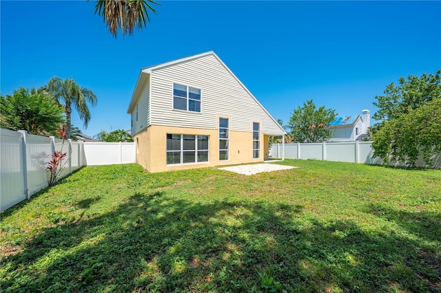 3203 Herons Point Cir, Kissimmee, FL 34741 - rear view of house featuring stucco siding and a patio