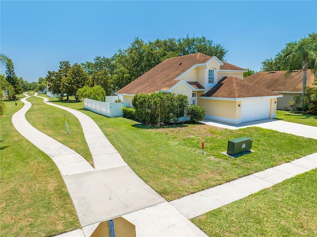 3203 Herons Point Cir, Kissimmee, FL 34741 - view of home's exterior with driveway, a garage, and stucco siding