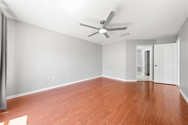 3203 Herons Point Cir, Kissimmee, FL 34741 - unfurnished room with ceiling fan, wood finished floors, and baseboards