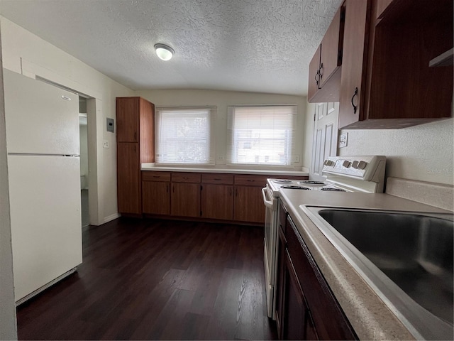 1413 11th St, Saint Cloud, FL 34769 - kitchen featuring white appliances, a sink, dark wood-style floors, light countertops, and brown cabinets