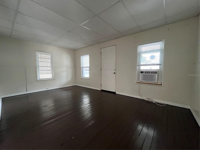 1413 11th St, Saint Cloud, FL 34769 - unfurnished room featuring a paneled ceiling, cooling unit, hardwood / wood-style floors, and baseboards