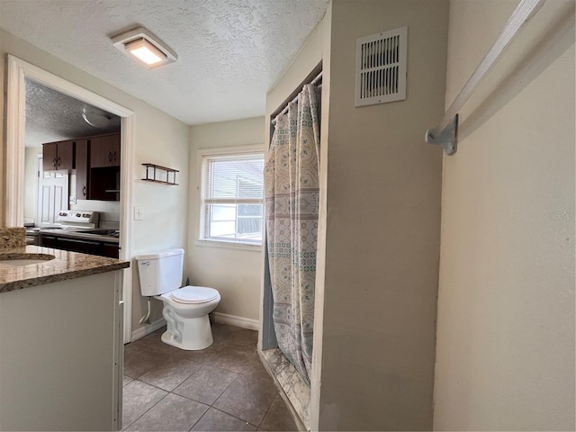 1413 11th St, Saint Cloud, FL 34769 - bathroom with toilet, a textured ceiling, vanity, tile patterned floors, and curtained shower