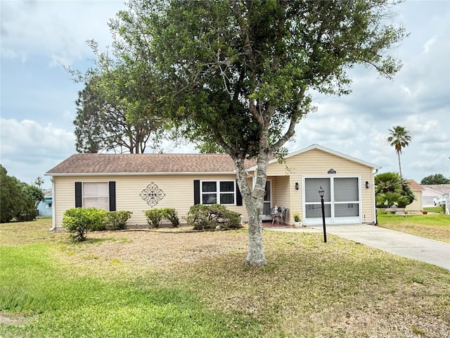 1410 Sanchez Ct, Lady Lake, FL 32159 - ranch-style house featuring a front lawn, concrete driveway, and an attached garage