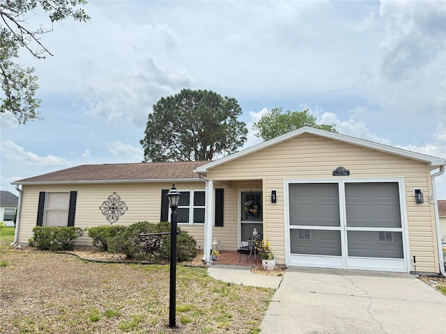 1410 Sanchez Ct, Lady Lake, FL 32159 - ranch-style house featuring driveway and a garage
