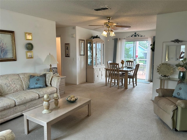 1410 Sanchez Ct, Lady Lake, FL 32159 - living room featuring light colored carpet, ceiling fan, and a textured ceiling