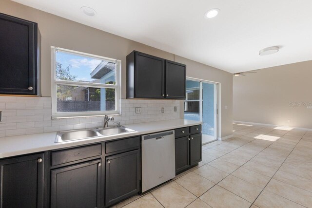 12303 Bohannon Blvd, Orlando, FL 32824 - kitchen with dishwasher, a sink, tasteful backsplash, and light countertops