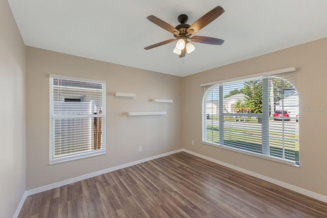 12303 Bohannon Blvd, Orlando, FL 32824 - empty room featuring wood finished floors, baseboards, and ceiling fan