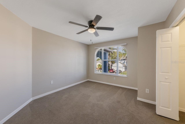 12303 Bohannon Blvd, Orlando, FL 32824 - spare room with carpet flooring, a ceiling fan, and baseboards