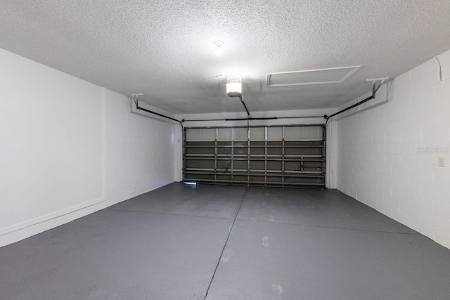 12303 Bohannon Blvd, Orlando, FL 32824 - garage featuring a garage door opener and concrete block wall