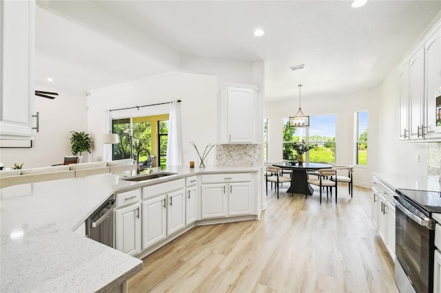 517 Milano Rd, Poinciana, FL 34759 - kitchen with a sink, electric range, dishwasher, tasteful backsplash, and recessed lighting