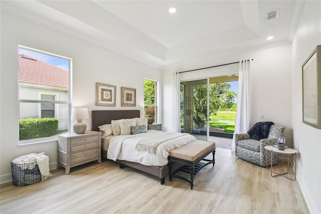 517 Milano Rd, Poinciana, FL 34759 - bedroom with a raised ceiling, access to exterior, wood finished floors, recessed lighting, and baseboards