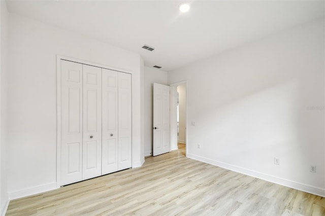 517 Milano Rd, Poinciana, FL 34759 - unfurnished bedroom with light wood-type flooring, baseboards, and recessed lighting