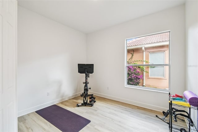 517 Milano Rd, Poinciana, FL 34759 - exercise room with wood finished floors and baseboards