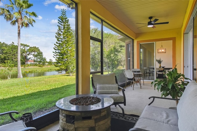 517 Milano Rd, Poinciana, FL 34759 - view of patio / terrace featuring a water view, an outdoor fire pit, and a ceiling fan