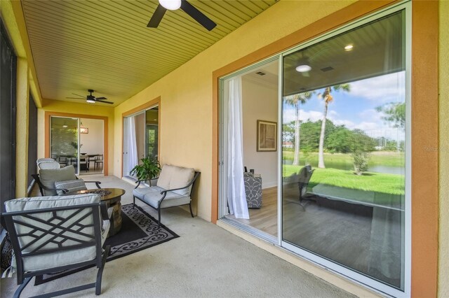 517 Milano Rd, Poinciana, FL 34759 - sunroom with ceiling fan, a water view, and an outdoor living space