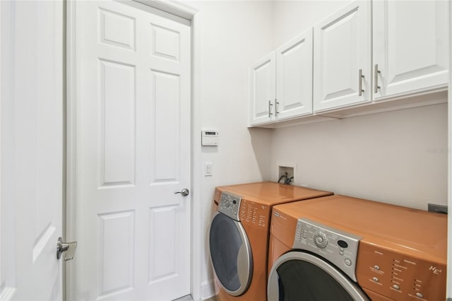 517 Milano Rd, Poinciana, FL 34759 - clothes washing area with independent washer and dryer and cabinet space
