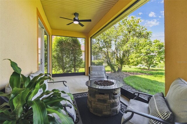 517 Milano Rd, Poinciana, FL 34759 - view of patio with an outdoor fire pit and a ceiling fan