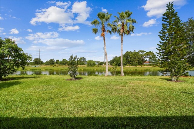 517 Milano Rd, Poinciana, FL 34759 - view of grassy yard featuring a water view