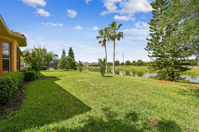 517 Milano Rd, Poinciana, FL 34759 - view of green lawn featuring a water view