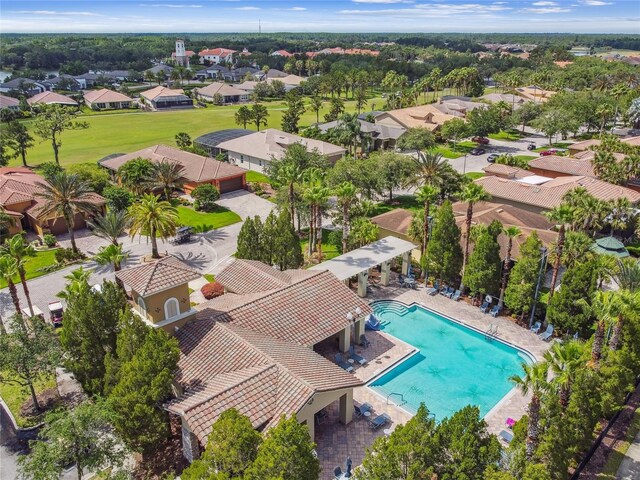 517 Milano Rd, Poinciana, FL 34759 - aerial perspective of suburban area featuring a pool area