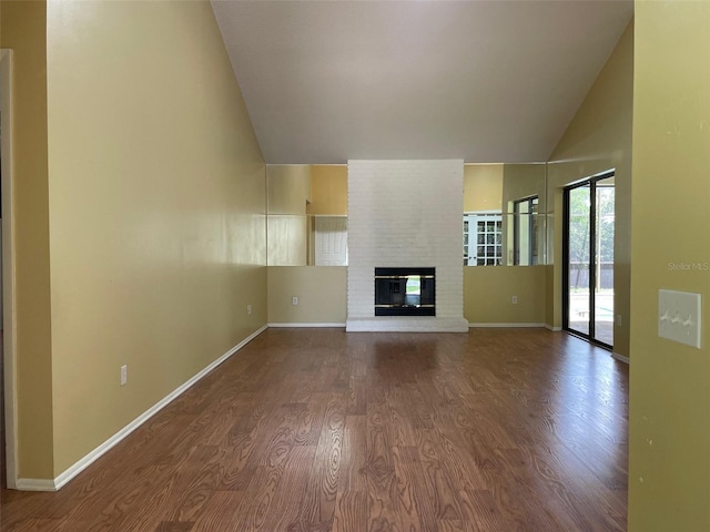 7200 Green Pine Ct, Orlando, FL 32819 - unfurnished living room featuring high vaulted ceiling, wood finished floors, and a fireplace