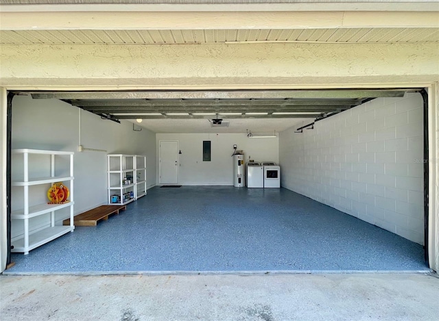 7200 Green Pine Ct, Orlando, FL 32819 - garage with washer and clothes dryer, water heater, electric panel, a garage door opener, and concrete block wall