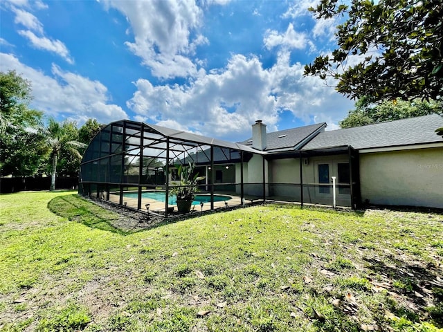 7200 Green Pine Ct, Orlando, FL 32819 - rear view of property with a yard, an outdoor pool, a chimney, stucco siding, and glass enclosure