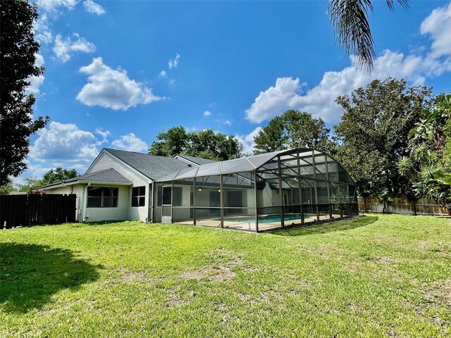 7200 Green Pine Ct, Orlando, FL 32819 - back of property featuring a fenced backyard, an outdoor pool, and a lanai