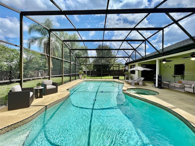 7200 Green Pine Ct, Orlando, FL 32819 - outdoor pool featuring an in-ground hot tub, a patio area, ceiling fan, outdoor lounge area, and glass enclosure