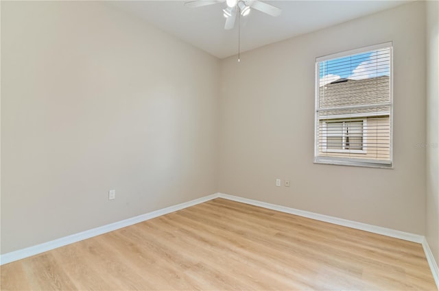 spare room with light wood-style floors, baseboards, and ceiling fan