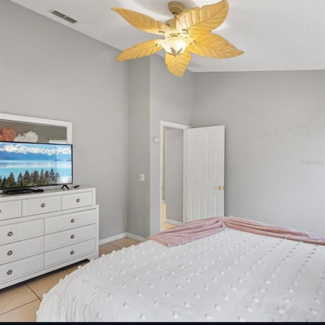 2567 Oneida Loop, Kissimmee, FL 34747 - bedroom featuring light tile patterned flooring, ceiling fan, and baseboards