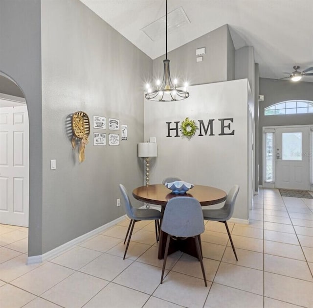 2567 Oneida Loop, Kissimmee, FL 34747 - dining room featuring high vaulted ceiling, light tile patterned floors, a chandelier, baseboards, and a ceiling fan