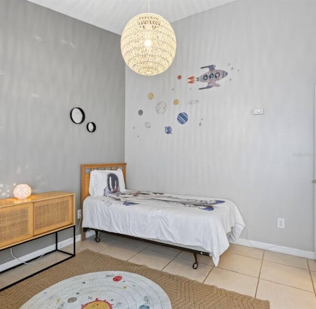2567 Oneida Loop, Kissimmee, FL 34747 - tiled bedroom featuring a chandelier and baseboards
