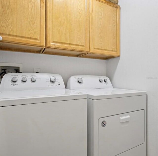 2567 Oneida Loop, Kissimmee, FL 34747 - washroom featuring cabinet space and washer and clothes dryer